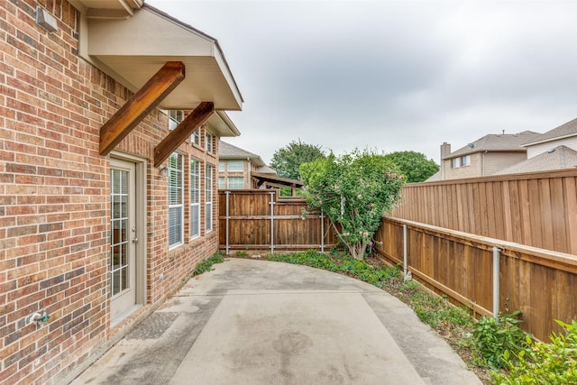 1728 Sandpiper Ln, Carrollton, TX 75007 - fenced backyard featuring a patio