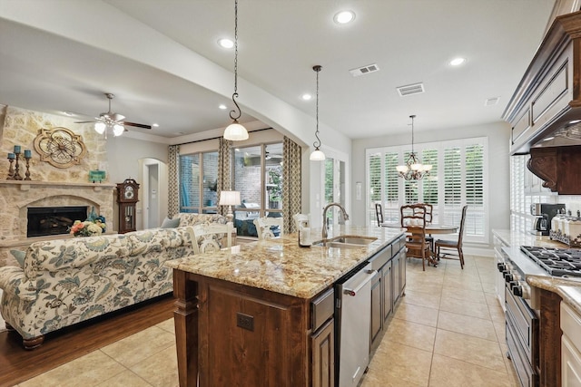 3500 Oak Island Ln, Flower Mound, TX 75028 - kitchen with a sink, stainless steel dishwasher, light tile patterned floors, dark brown cabinetry, and open floor plan