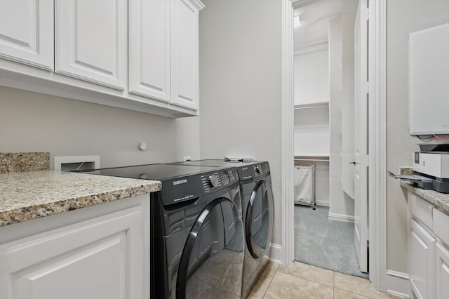 3500 Oak Island Ln, Flower Mound, TX 75028 - laundry area with washer and dryer, cabinet space, and light tile patterned floors
