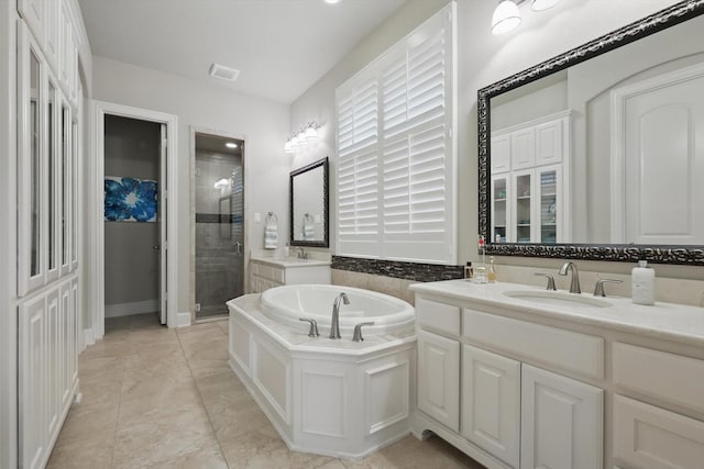 3500 Oak Island Ln, Flower Mound, TX 75028 - bathroom with a stall shower, vanity, a bath, and tile patterned floors