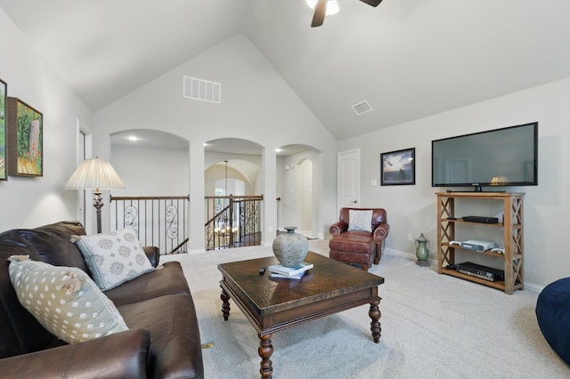 3500 Oak Island Ln, Flower Mound, TX 75028 - living area with arched walkways, a ceiling fan, carpet floors, and high vaulted ceiling
