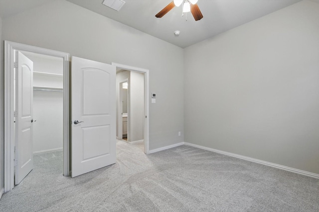 3500 Oak Island Ln, Flower Mound, TX 75028 - unfurnished bedroom featuring carpet floors, a walk in closet, baseboards, and a ceiling fan