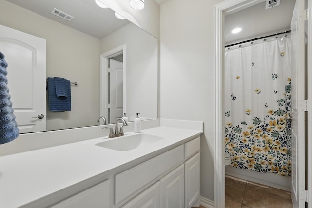 3500 Oak Island Ln, Flower Mound, TX 75028 - full bath featuring vanity, tile patterned floors, curtained shower, baseboards, and recessed lighting