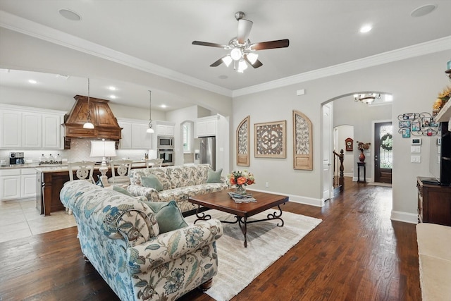 3500 Oak Island Ln, Flower Mound, TX 75028 - living area featuring arched walkways, ceiling fan, wood finished floors, crown molding, and recessed lighting