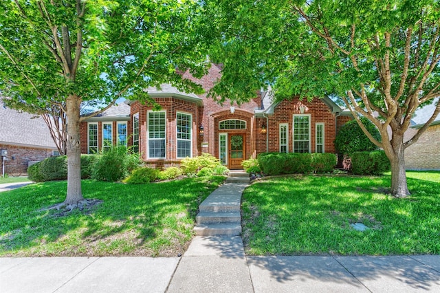 507 Clover Leaf Ln, Mckinney, TX 75072 - traditional home with brick siding and a front yard