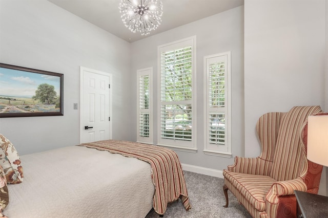 507 Clover Leaf Ln, Mckinney, TX 75072 - carpeted bedroom with a chandelier and baseboards