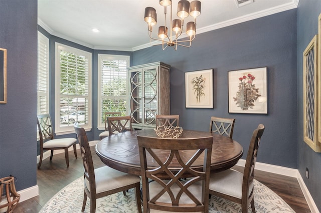 507 Clover Leaf Ln, Mckinney, TX 75072 - dining space featuring wood finished floors, baseboards, ornamental molding, and a chandelier