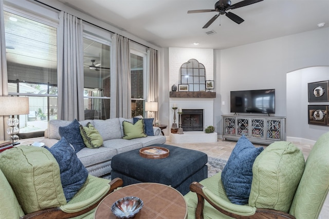 507 Clover Leaf Ln, Mckinney, TX 75072 - living area with a ceiling fan, baseboards, and a large fireplace