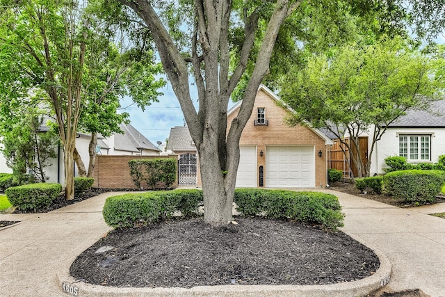 4605 Lafayette Ave, Fort Worth, TX 76107 - view of front of house with a garage, concrete driveway, and brick siding
