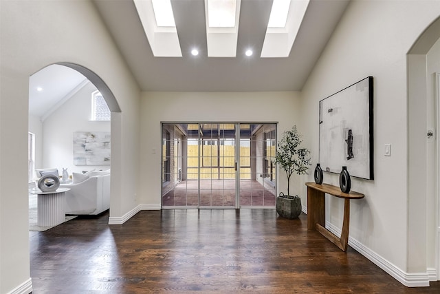 4605 Lafayette Ave, Fort Worth, TX 76107 - entryway featuring wood finished floors, recessed lighting, baseboards, arched walkways, and a skylight