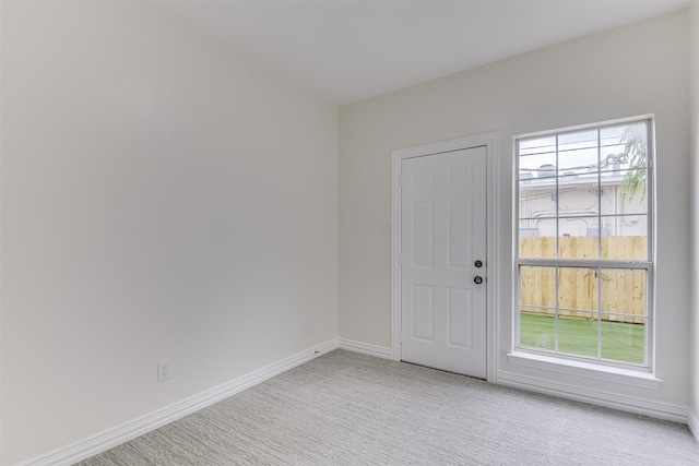4605 Lafayette Ave, Fort Worth, TX 76107 - entrance foyer with baseboards and light carpet