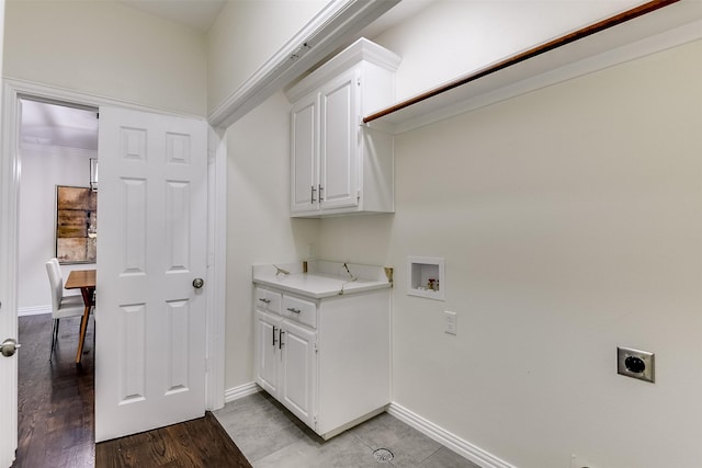 4605 Lafayette Ave, Fort Worth, TX 76107 - laundry area with hookup for an electric dryer, baseboards, washer hookup, and cabinet space
