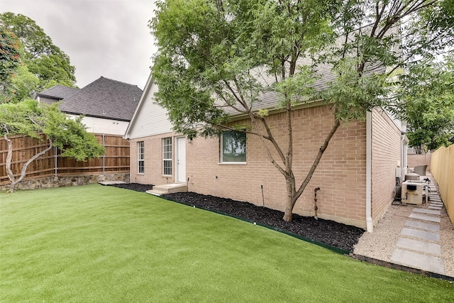 4605 Lafayette Ave, Fort Worth, TX 76107 - rear view of house featuring brick siding and roof with shingles