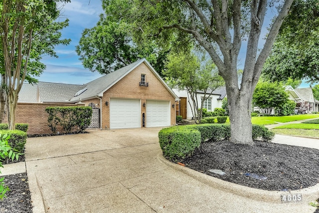 4605 Lafayette Ave, Fort Worth, TX 76107 - view of front facade with brick siding and driveway