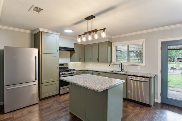 120 Rosedale Dr, Athens, TX 75751 - kitchen with stainless steel appliances, a sink, ornamental molding, dark wood-style flooring, and hanging light fixtures