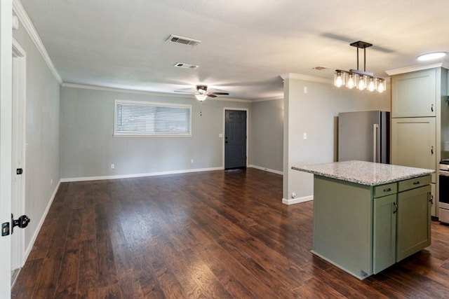 120 Rosedale Dr, Athens, TX 75751 - kitchen featuring green cabinetry, freestanding refrigerator, a center island, ornamental molding, and ceiling fan