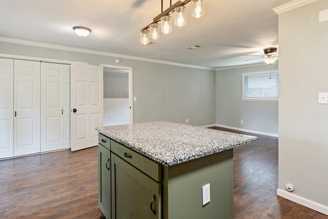 120 Rosedale Dr, Athens, TX 75751 - kitchen with a ceiling fan, dark wood-style floors, crown molding, a center island, and baseboards