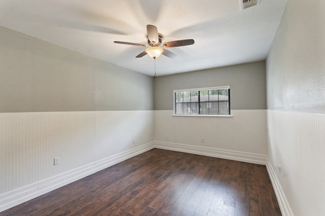 120 Rosedale Dr, Athens, TX 75751 - unfurnished room with a wainscoted wall, hardwood / wood-style floors, a ceiling fan, and baseboards