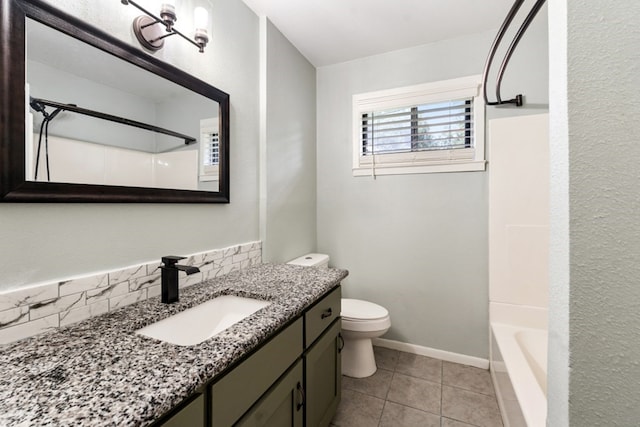 120 Rosedale Dr, Athens, TX 75751 - full bathroom featuring vanity, toilet, tile patterned flooring, tasteful backsplash, and baseboards