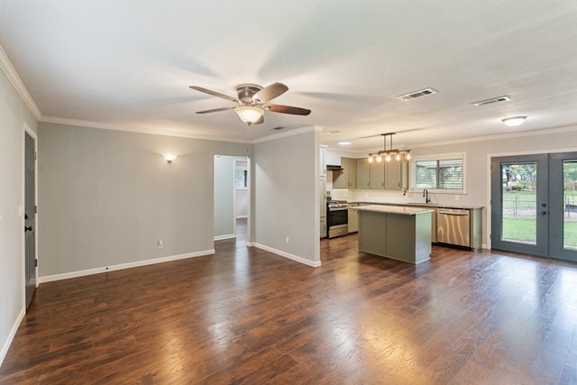 120 Rosedale Dr, Athens, TX 75751 - kitchen featuring appliances with stainless steel finishes, french doors, open floor plan, a kitchen island, and ornamental molding