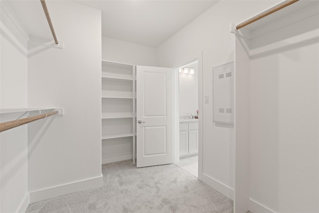 8120 Bromley Dr, Dallas, TX 75231 - spacious closet featuring light colored carpet and a sink