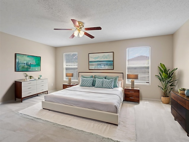 7605 Mosspoint Ct, Denton, TX 76210 - bedroom with carpet flooring, baseboards, a ceiling fan, and a textured ceiling