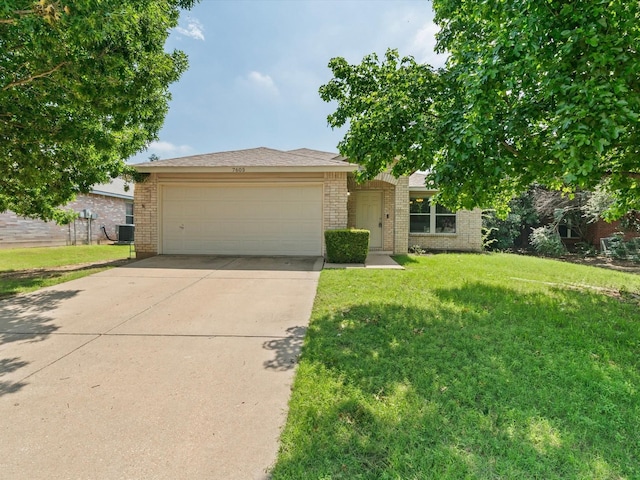 7605 Mosspoint Ct, Denton, TX 76210 - view of front facade with brick siding, a garage, central AC, driveway, and a front yard