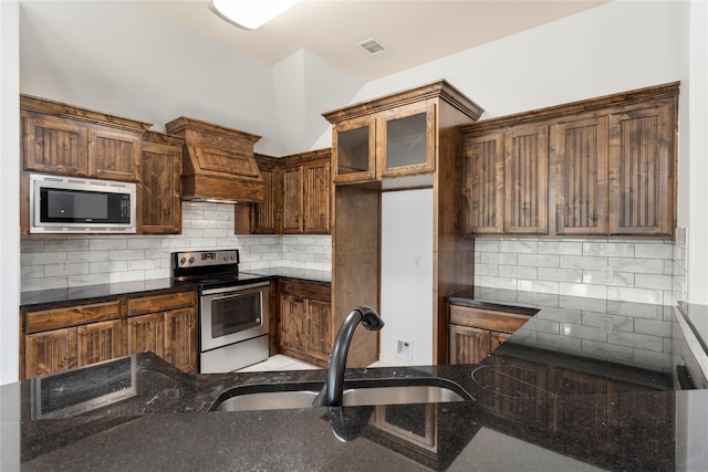 238 Rudder, Gun Barrel City, TX 75156 - kitchen with stainless steel appliances, custom range hood, a sink, and backsplash