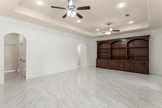 238 Rudder, Gun Barrel City, TX 75156 - empty room with a raised ceiling, arched walkways, ceiling fan, recessed lighting, and baseboards