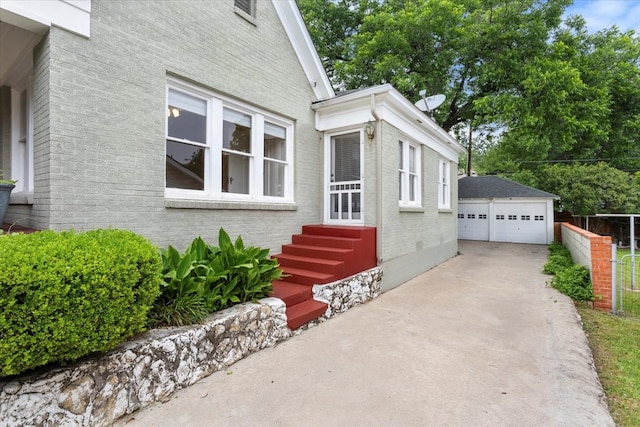 4016 Pershing Ave, Fort Worth, TX 76107 - view of front facade with brick siding, a detached garage, entry steps, and an outbuilding
