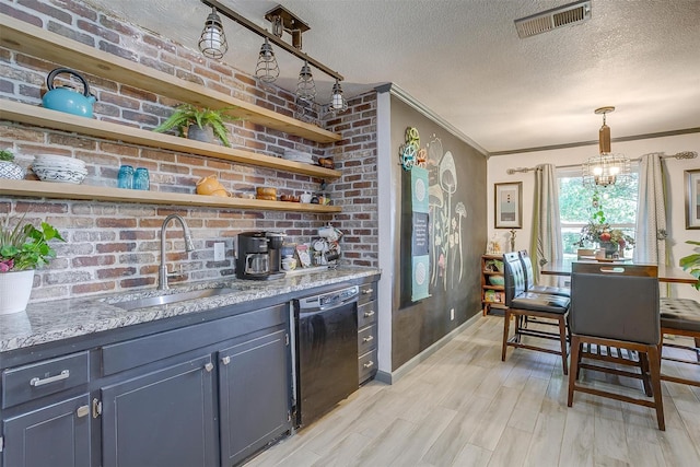 905 E Renfro St, Burleson, TX 76028 - kitchen with dishwasher, a sink, open shelves, a textured ceiling, and light wood-style flooring