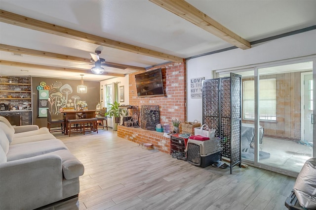 905 E Renfro St, Burleson, TX 76028 - living room with beamed ceiling, wood finished floors, and ceiling fan