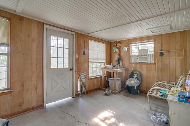 905 E Renfro St, Burleson, TX 76028 - doorway with wood walls, concrete flooring, and cooling unit