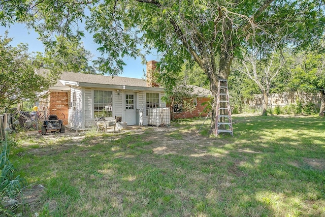 905 E Renfro St, Burleson, TX 76028 - rear view of property with a chimney