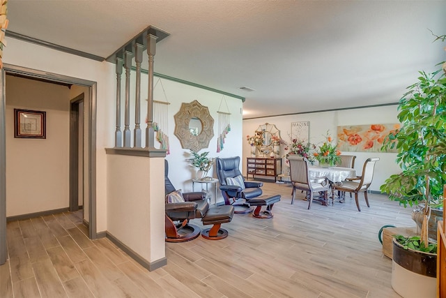 905 E Renfro St, Burleson, TX 76028 - sitting room featuring light wood-type flooring, baseboards, and crown molding