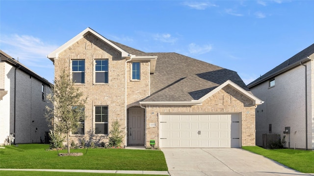 1632 Elle Ln, Aubrey, TX 76227 - traditional-style home featuring driveway, brick siding, a front yard, a garage, and central AC unit