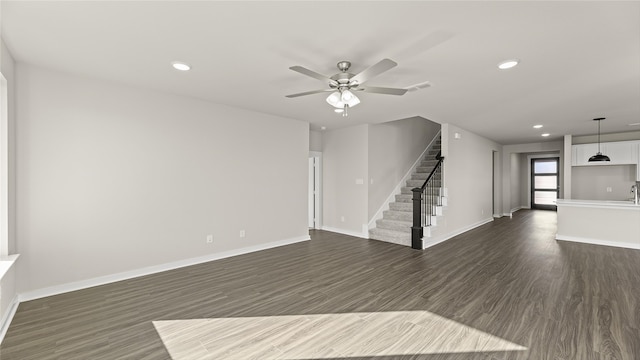 1632 Elle Ln, Aubrey, TX 76227 - unfurnished living room featuring dark wood-style floors, stairway, a ceiling fan, recessed lighting, and baseboards
