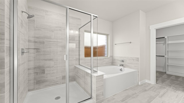 1632 Elle Ln, Aubrey, TX 76227 - bathroom featuring a shower stall, a garden tub, and a walk in closet