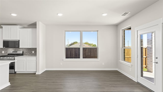 1632 Elle Ln, Aubrey, TX 76227 - kitchen with stainless steel range with gas stovetop, light countertops, white cabinetry, dark wood-style floors, and recessed lighting