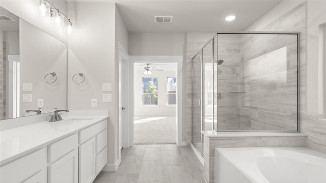 1632 Elle Ln, Aubrey, TX 76227 - bathroom with vanity, a garden tub, a ceiling fan, a shower stall, and recessed lighting