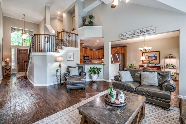 7201 Faraday Ln, Mckinney, TX 75071 - living area with a chandelier, a towering ceiling, stairway, wood finished floors, and baseboards