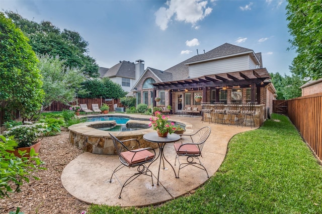 7201 Faraday Ln, Mckinney, TX 75071 - back of property featuring a pergola, brick siding, a patio area, a pool with connected hot tub, and a shingled roof
