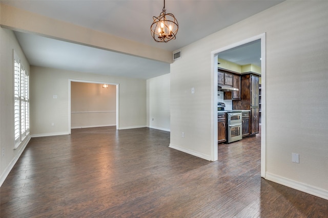 10118 Cromwell Dr, Dallas, TX 75229 - empty room with a chandelier, baseboards, and dark wood-style flooring