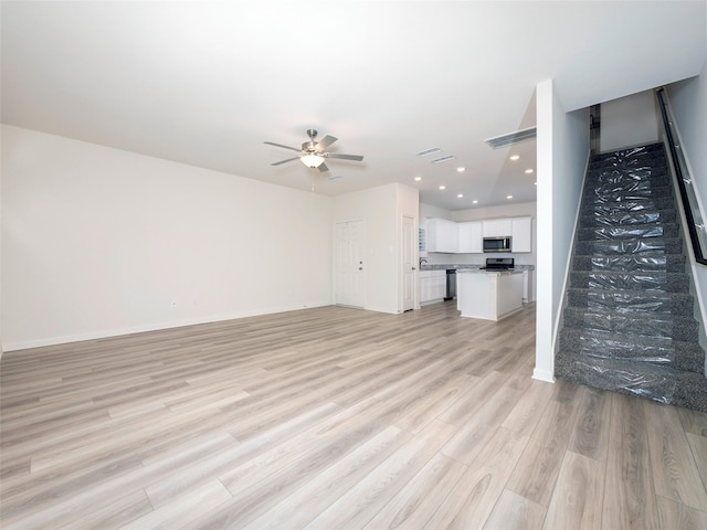 1218 Parker Dr, Princeton, TX 75407 - unfurnished living room featuring light wood-style flooring, a ceiling fan, and recessed lighting