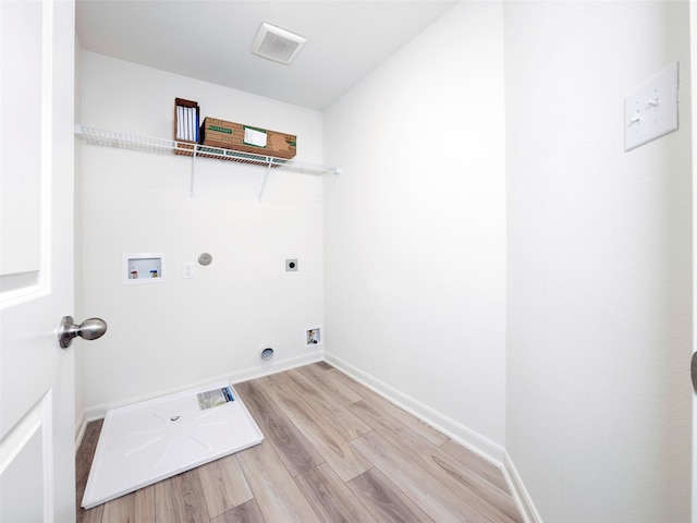1218 Parker Dr, Princeton, TX 75407 - washroom with hookup for an electric dryer, wood finished floors, hookup for a gas dryer, and hookup for a washing machine