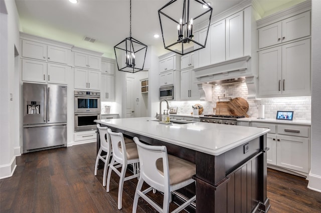 2021 Longmont Ln, Prosper, TX 75078 - kitchen with appliances with stainless steel finishes, a chandelier, tasteful backsplash, light countertops, and recessed lighting