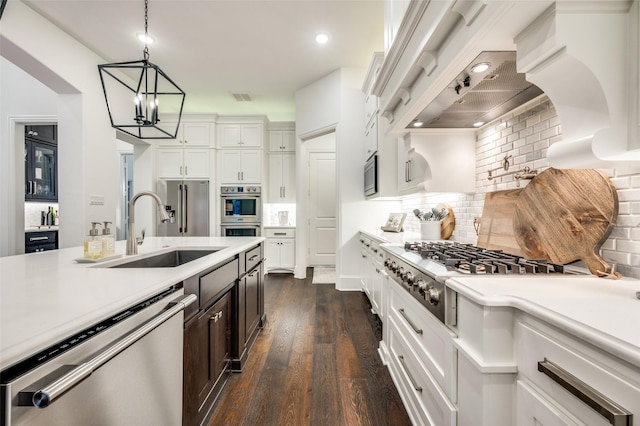 2021 Longmont Ln, Prosper, TX 75078 - kitchen with appliances with stainless steel finishes, a sink, light countertops, backsplash, and recessed lighting