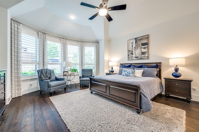 2021 Longmont Ln, Prosper, TX 75078 - bedroom with multiple windows, lofted ceiling, wood finished floors, baseboards, and ceiling fan