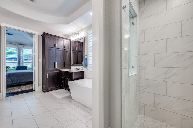2021 Longmont Ln, Prosper, TX 75078 - full bath with a tile shower, a freestanding bath, ensuite bath, vanity, and marble finish floors