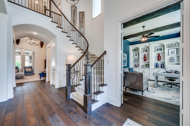 2021 Longmont Ln, Prosper, TX 75078 - entrance foyer with hardwood / wood-style floors, arched walkways, stairs, ceiling fan, and a high ceiling